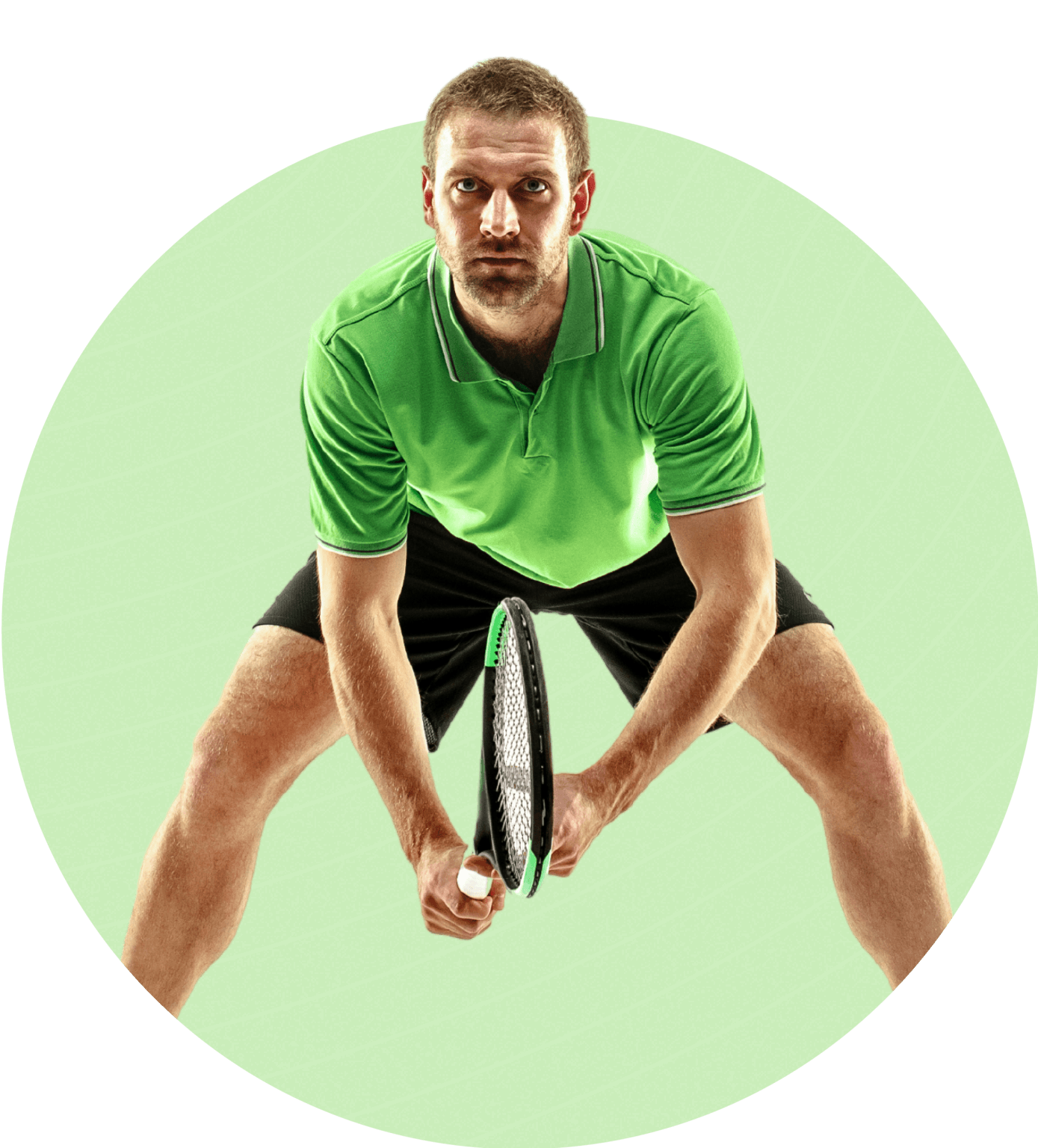 Man in green sports shirt holding a tennis racket, ready to play.