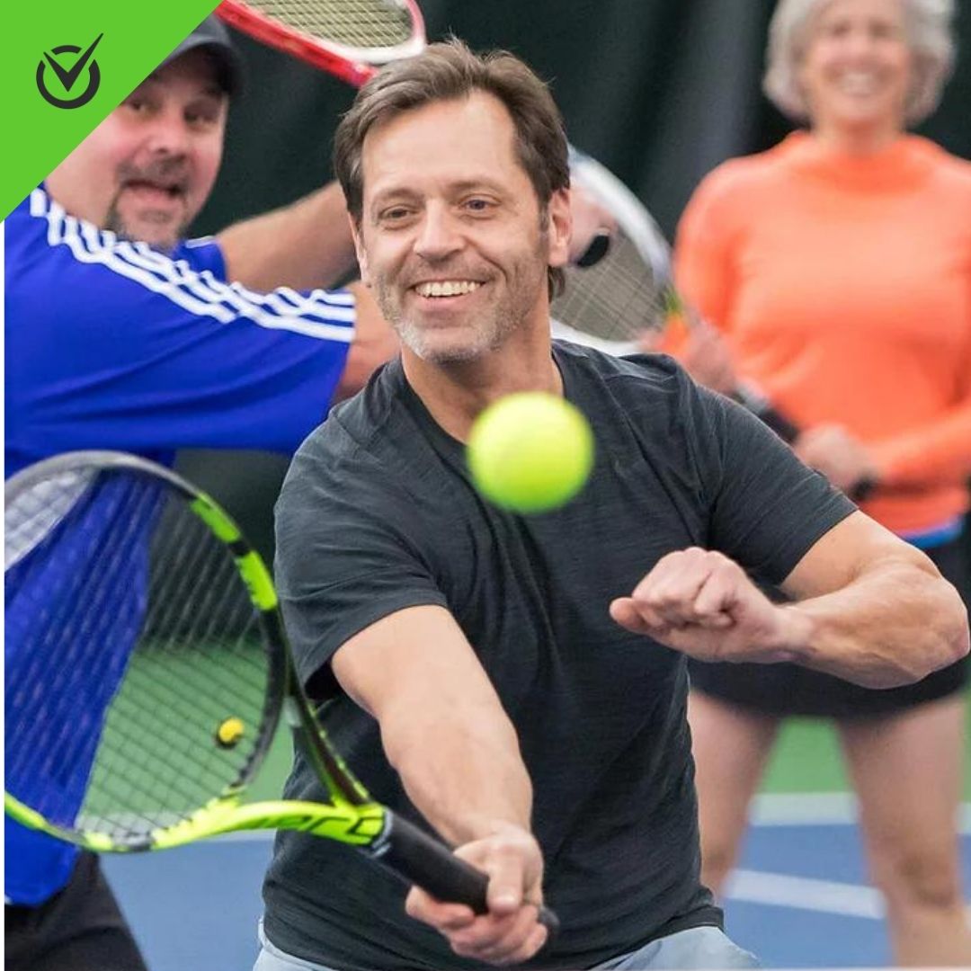 Photo of Western Athletic Club players hitting a tennis ball