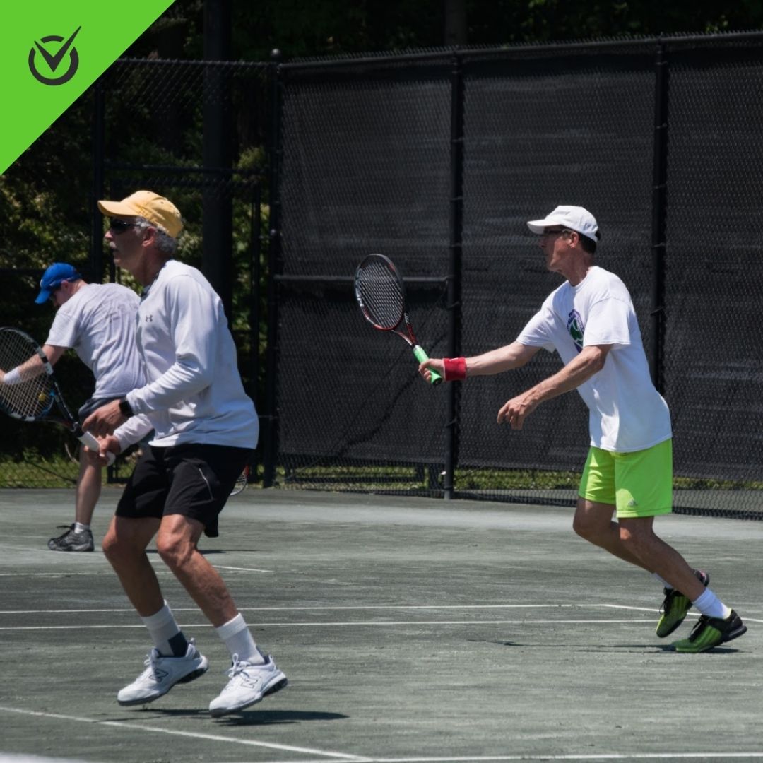 Photo of Hollow Rock Racquet and Swim Club members playing tennis on outdoor court