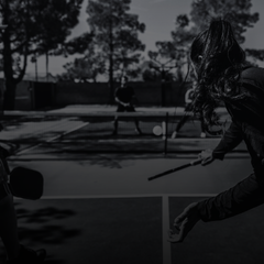 People playing pickleball outdoors