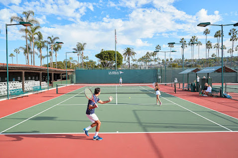 photo of 2 tennis players mid-game