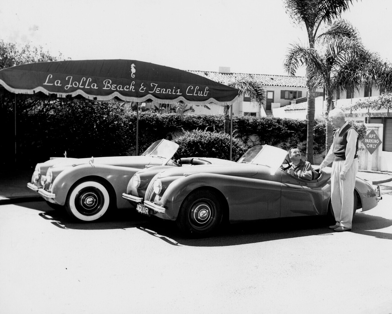 black and white photo of vintage cars parked at la jolla club back in the day