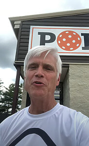 Person with medals, praising CourtReserve, quote by Lee Martin, Pavilion of Pickleball owner