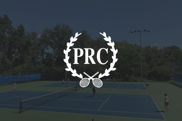 Outdoor courts with players in background with Princeton Racquet Club logo in foreground