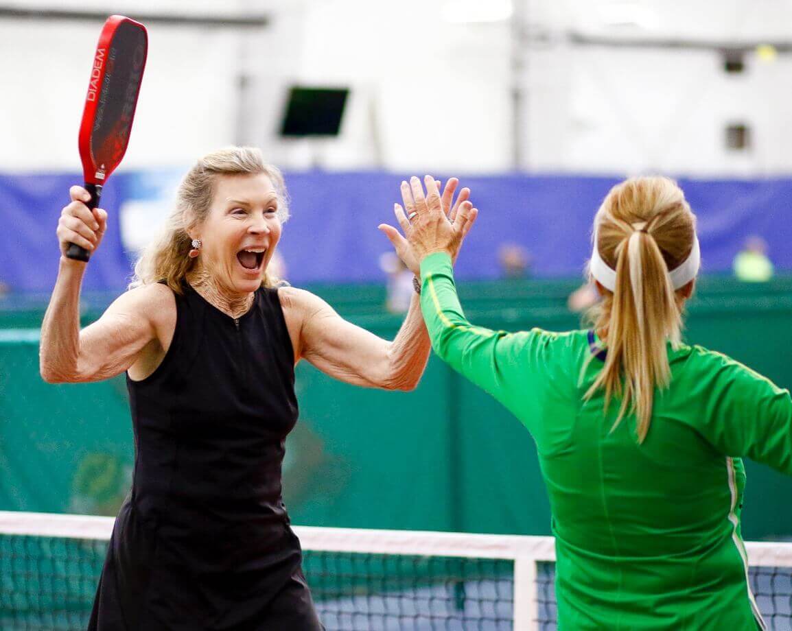 Dill Dinkers' players high-five.