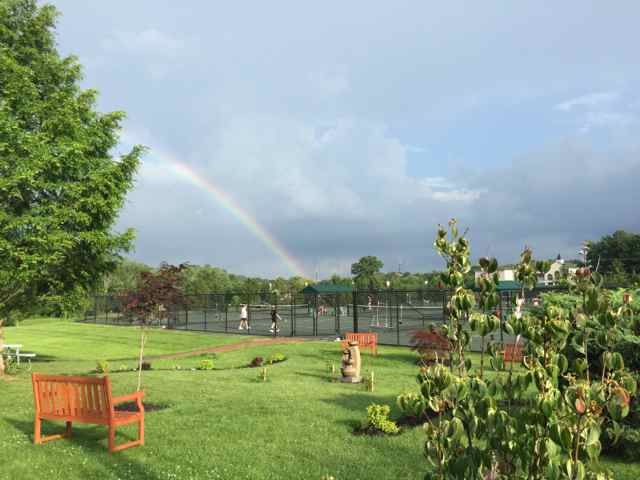 PRC's memorial garden with rainbow in sky