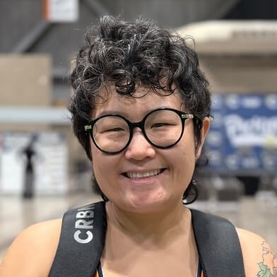 Person wearing blue thunder 2 jersey and backpack in large indoor space
