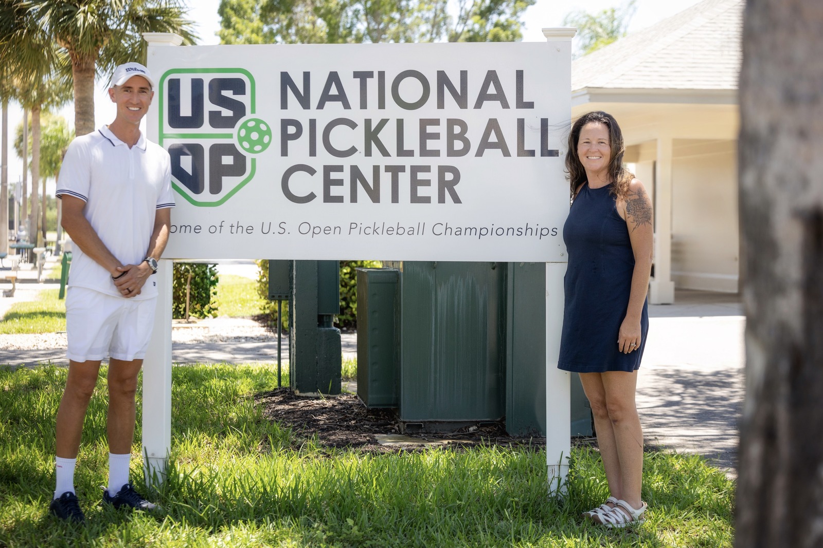 Justin Romero and Ashley Owens in front of USOP sign