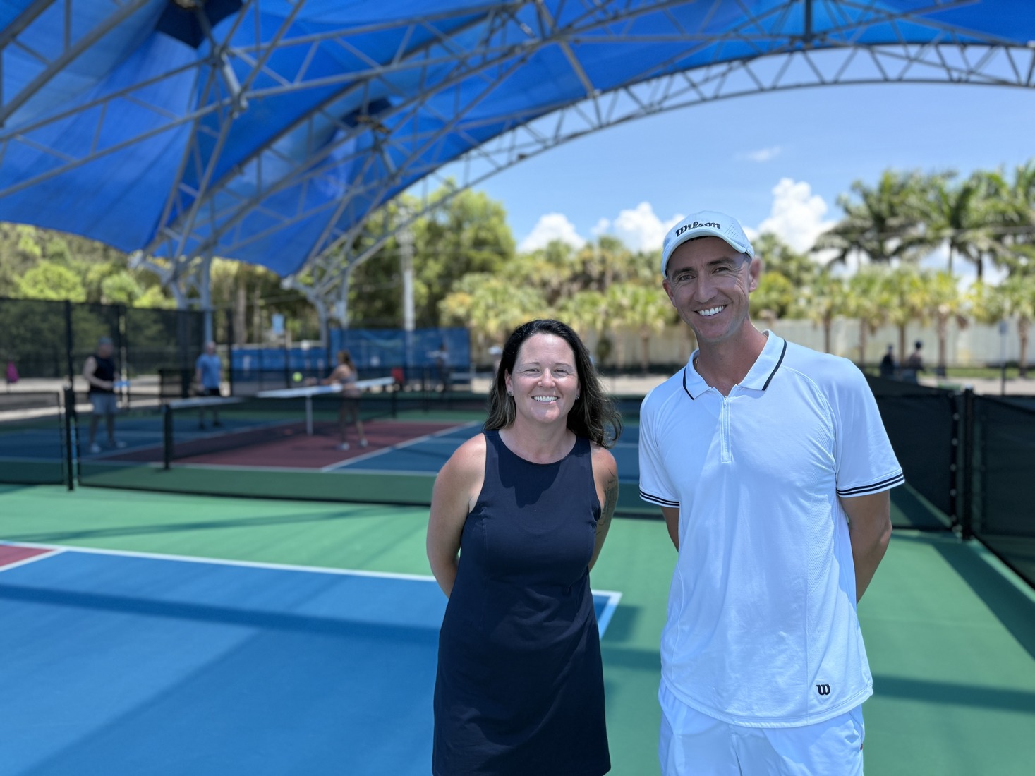 Ashley Owens and Justin Romero on a championship court.