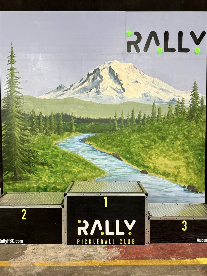 A tournament podium with Rally Pickleball Club branding