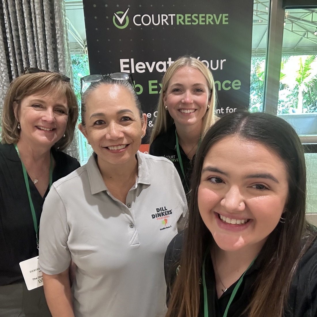 courtreserve-dill-dinkers-event Four women smiling at a CourtReserve event